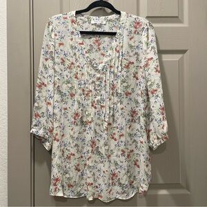 White V-Neck Multi-Colored Floral Patterned Blouse Halfway Button Down